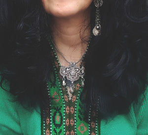 Flowery Repoussee Silver Pendant on Braided Chain