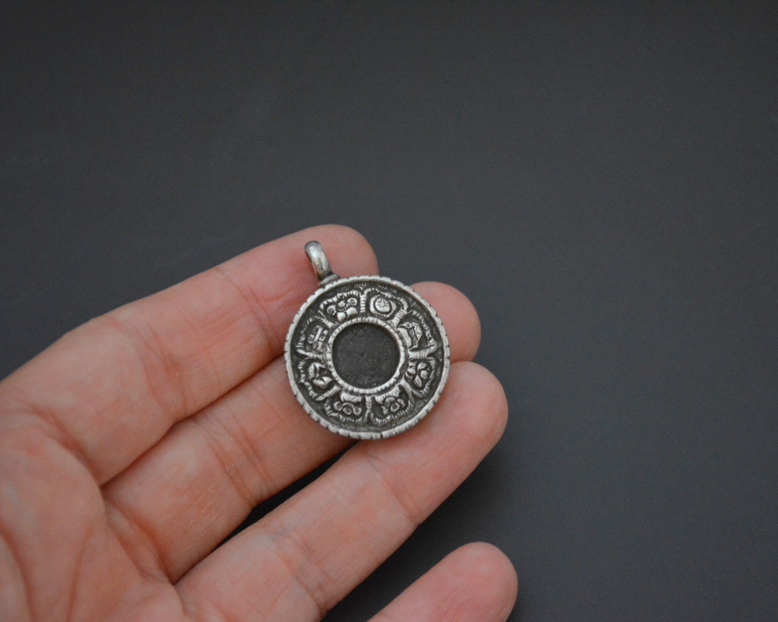 Nepali Resin Silver Pendant with Repoussee Setting
