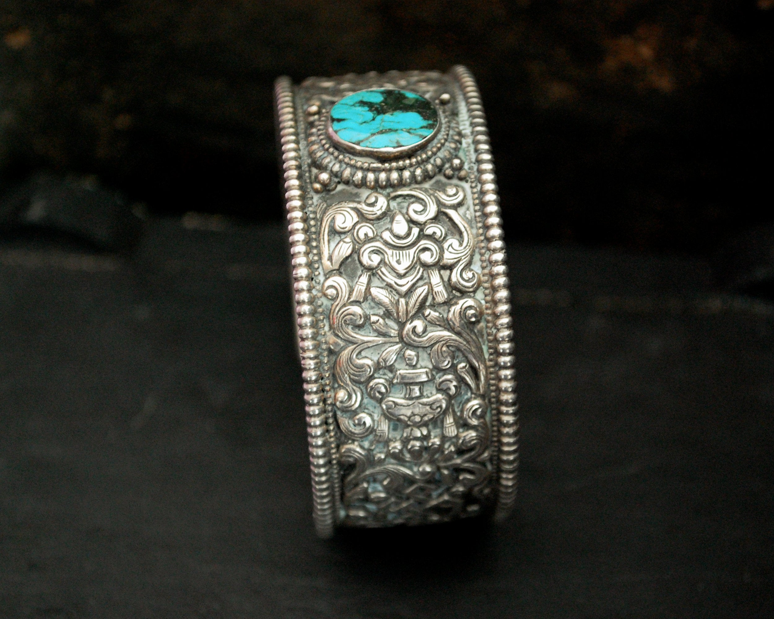 Fabulous Nepali Turquoise Repoussee Bracelet with Eight Auspicious Symbols