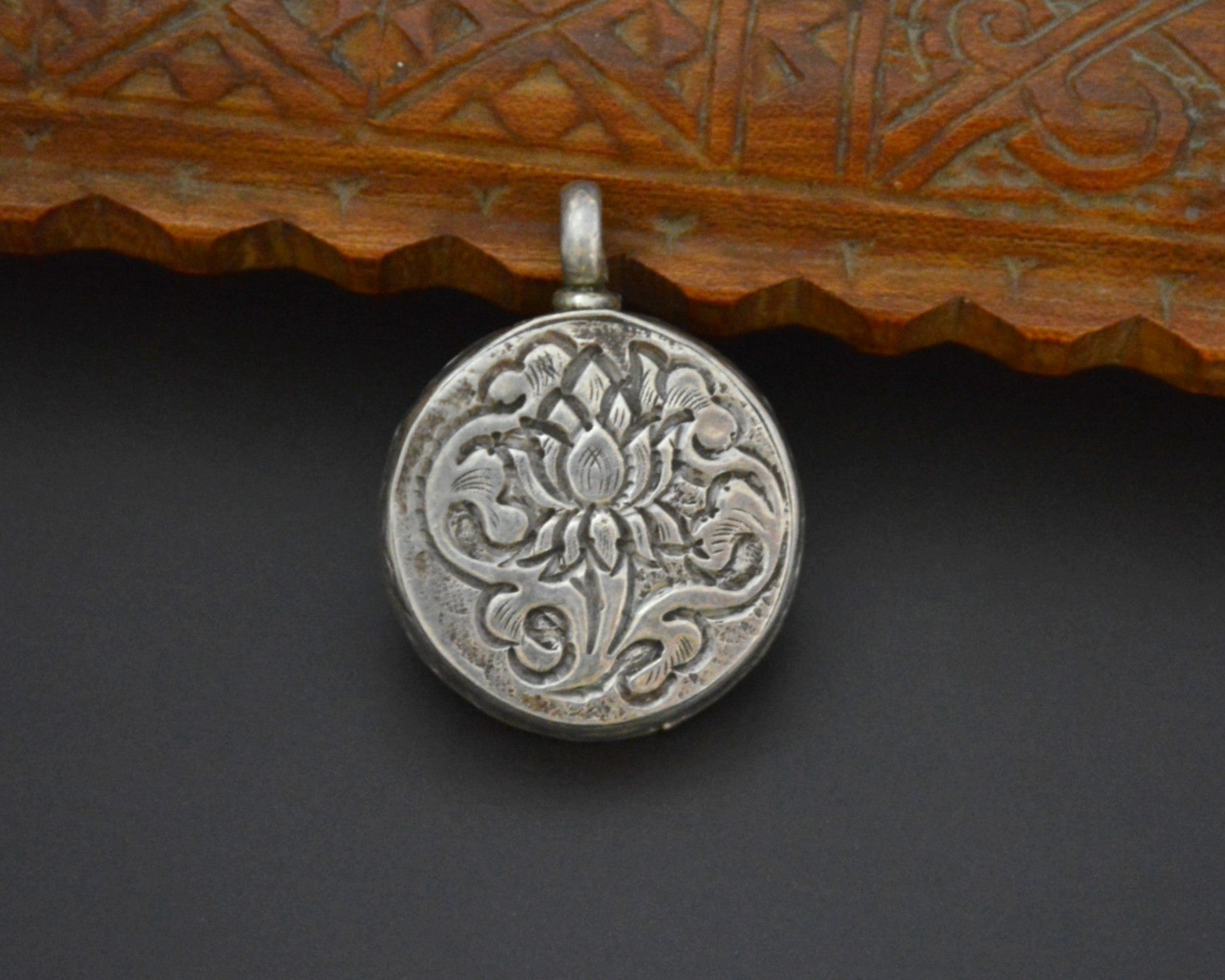 Nepali Resin Silver Pendant with Repoussee Setting