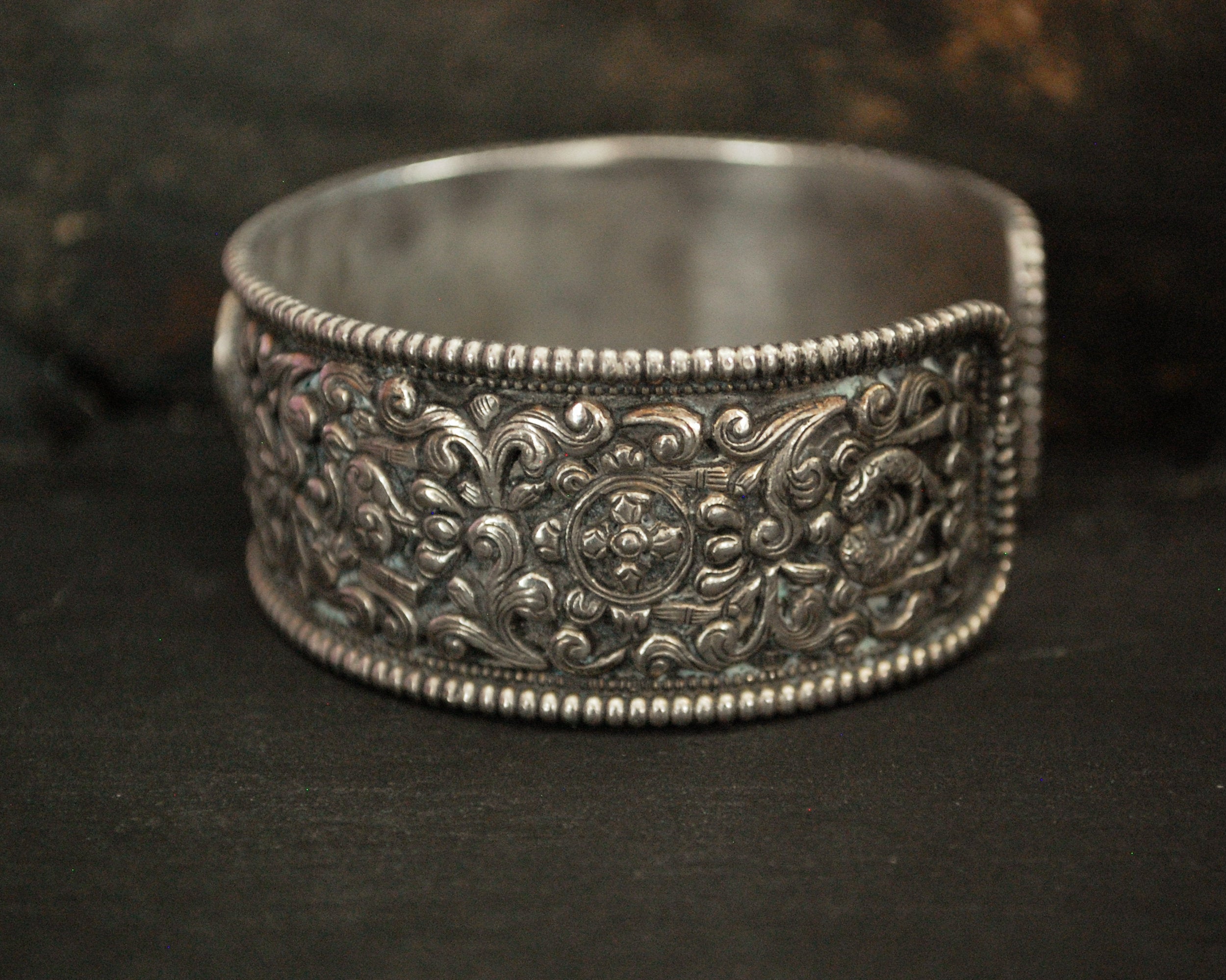 Fabulous Nepali Turquoise Repoussee Bracelet with Eight Auspicious Symbols