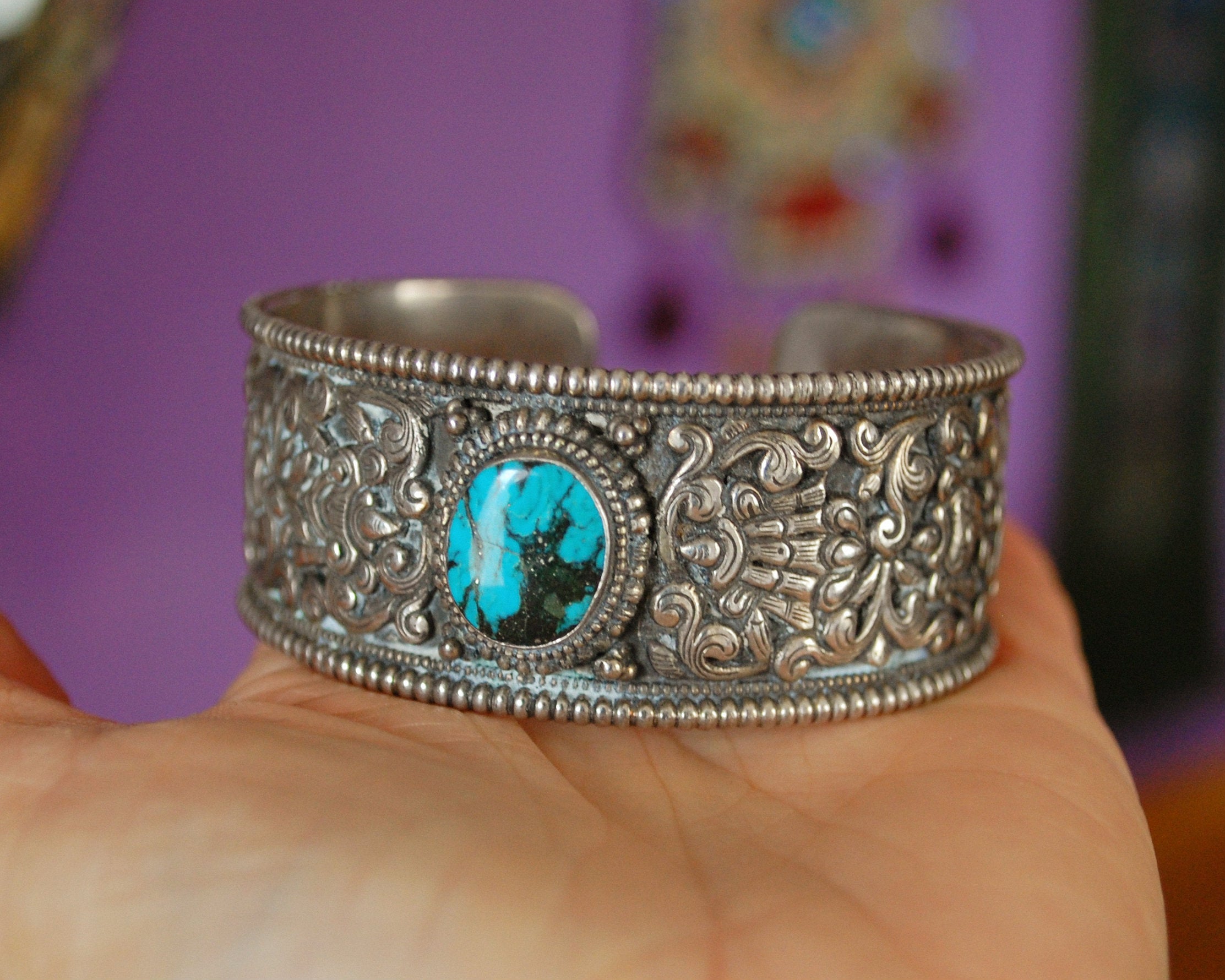 Fabulous Nepali Turquoise Repoussee Bracelet with Eight Auspicious Symbols